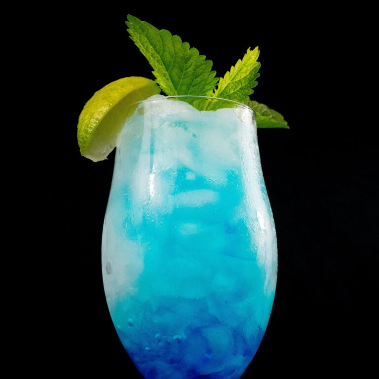 Blue Curacao Drink in glass on black background